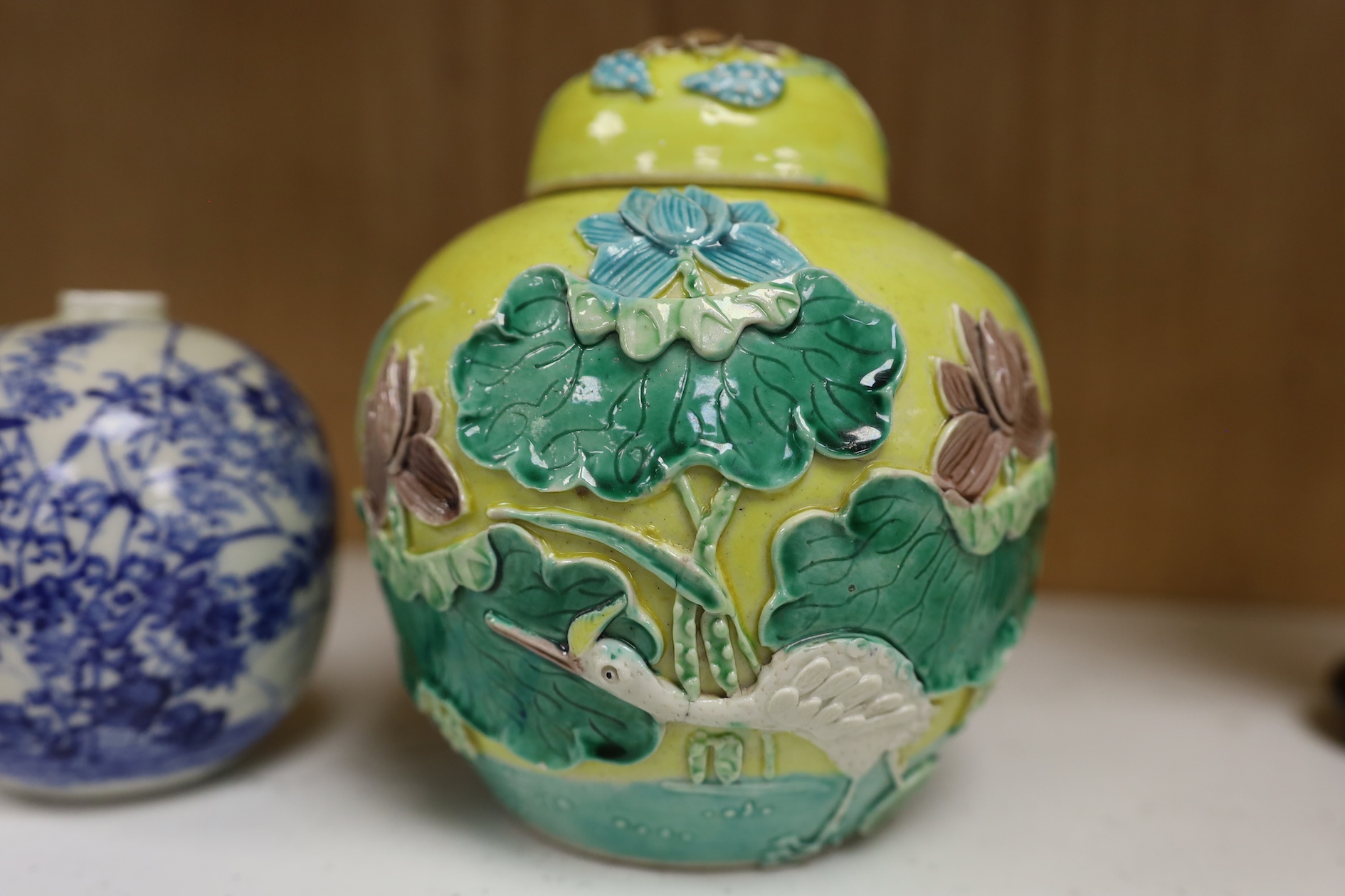 A Chinese polychrome glazed jar and cover, a Wangbinrong mark and a Japanese jar, jar and cover 14.5cm high. Condition - good